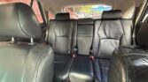 Back seat of a car with black leather upholstery and three seating positions with headrests and belts visible?